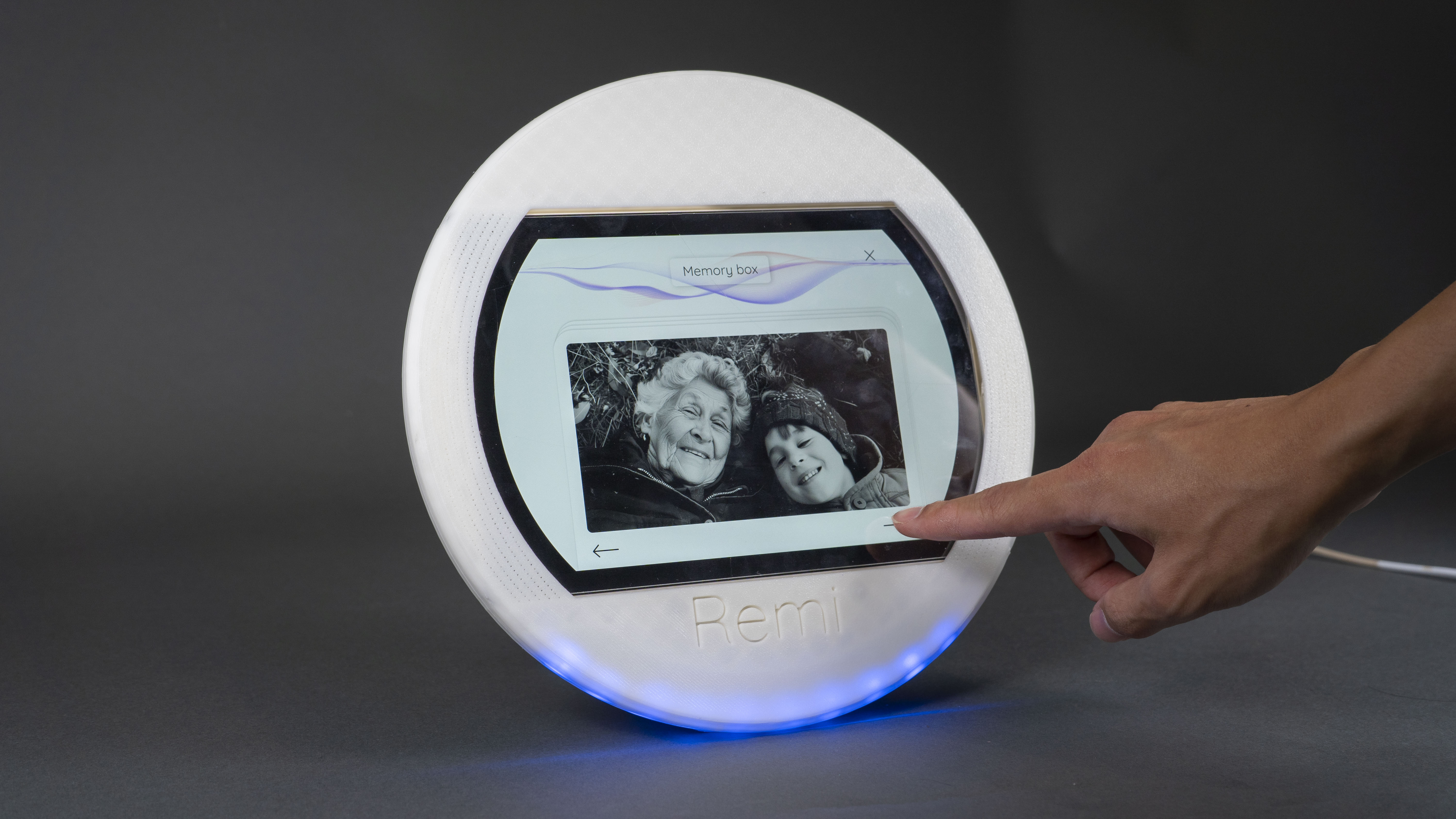 Hands holding printed photographs